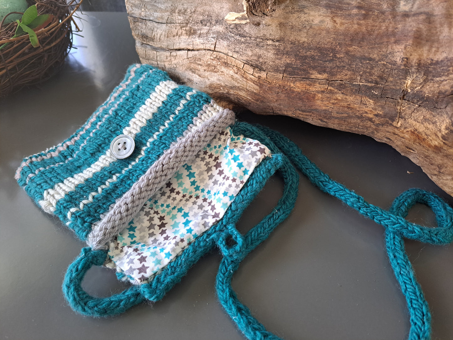 blue, white and gray stripe knit purse with starry fabric lining