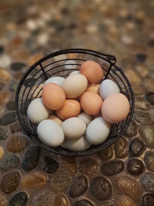Basket of eggs on a textured stone surface