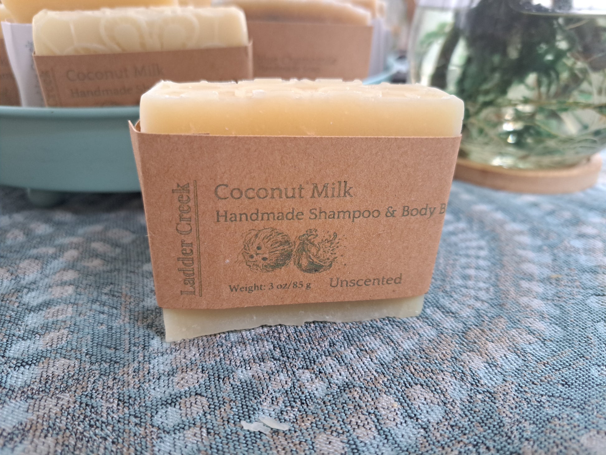 Coconut Milk handmade shampoo bar on a textured surface with 'Ladder Creek' branding.